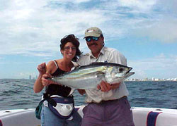 Blackfin tuna with Miami skyline in the background