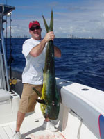 Bull dolphin catch with Miami skyline in the background