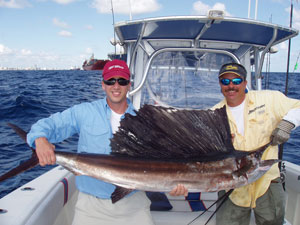 Holding a sailfish catch