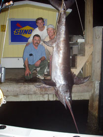 A swordfish on display at the dock